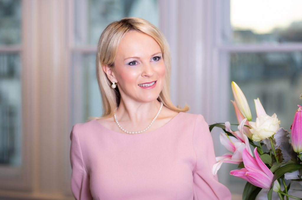 Pretty lady in pink wearing pearls