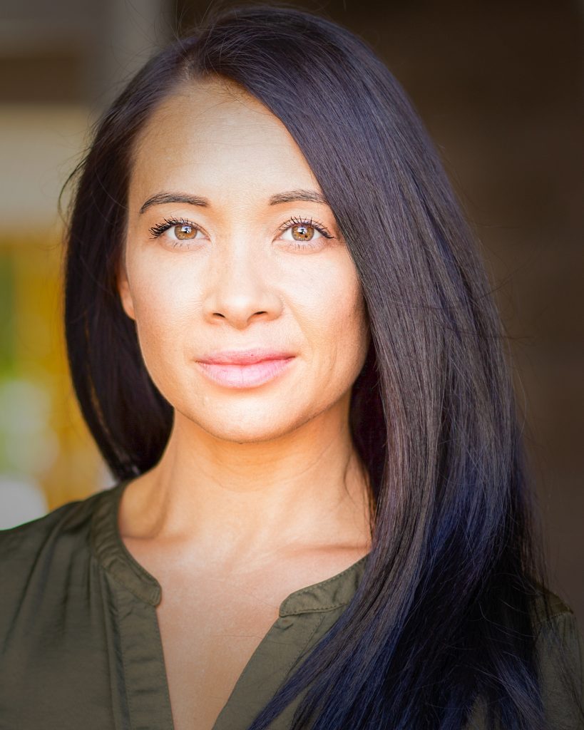 Asian actress in green shirt with green eyes
