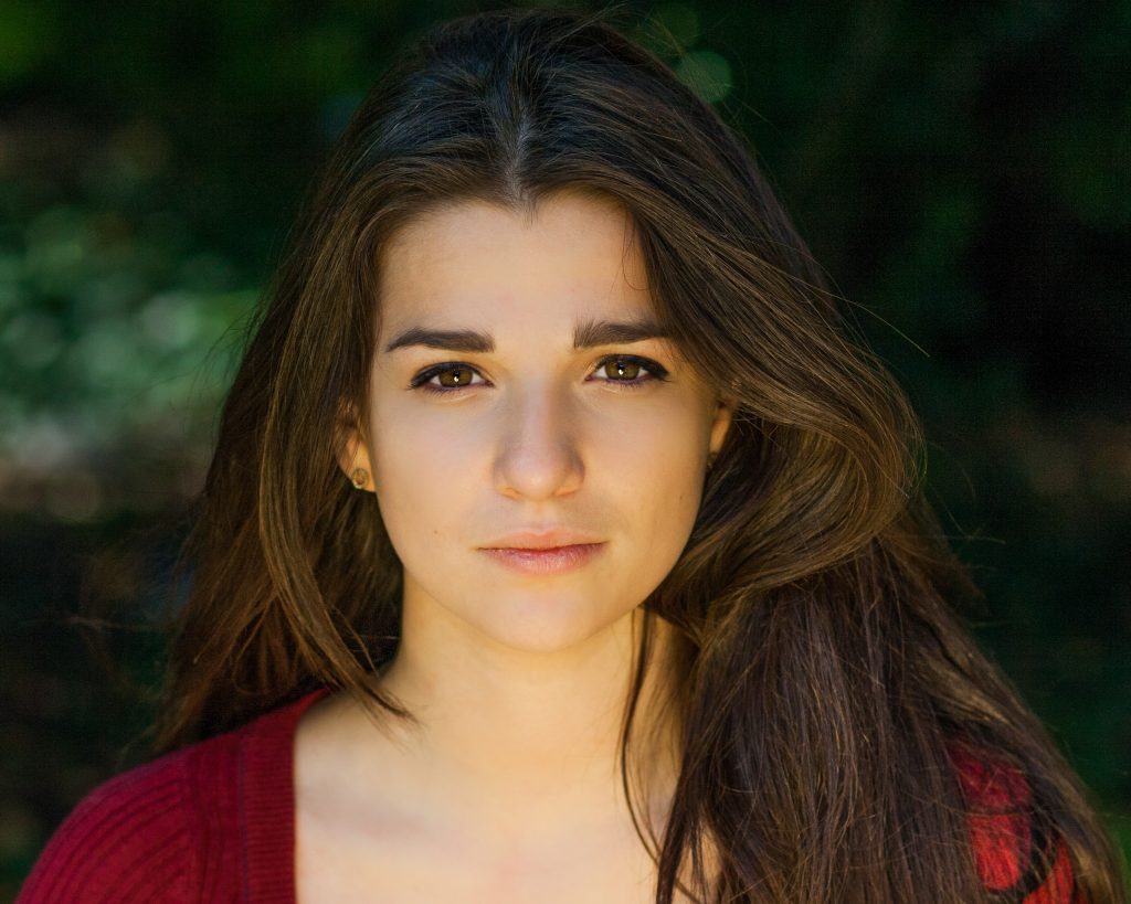 Marisa Abela, actress with red top