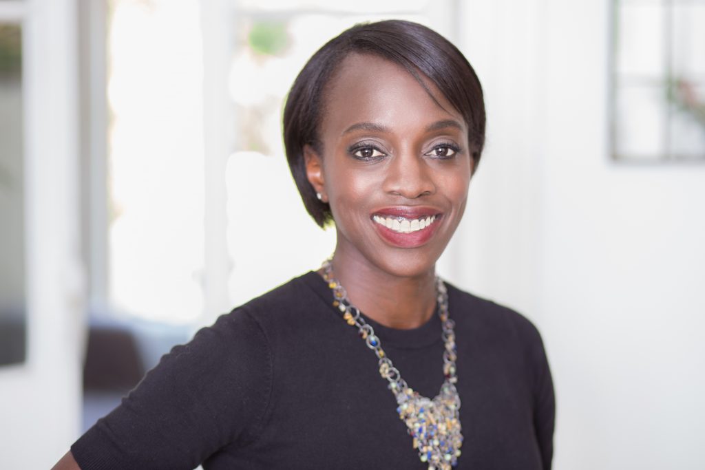 Smart black corporate woman in elaborate necklace
