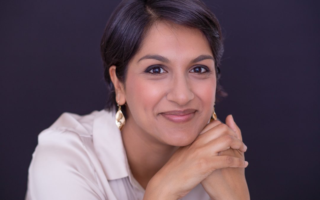 Woman smiling with grey background
