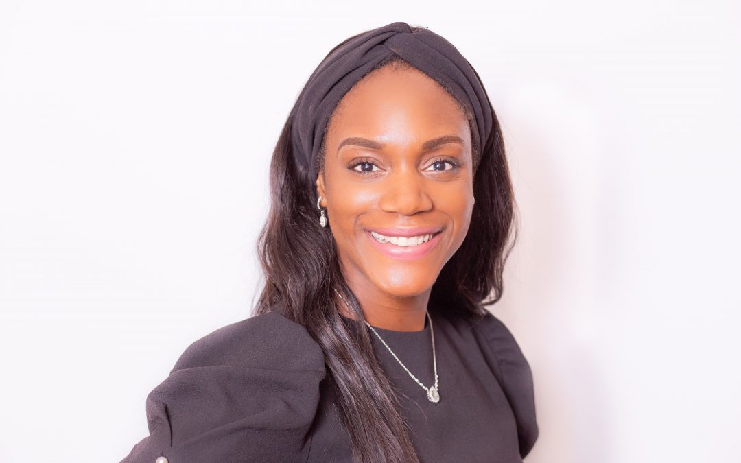 Black girl with black top against a white background
